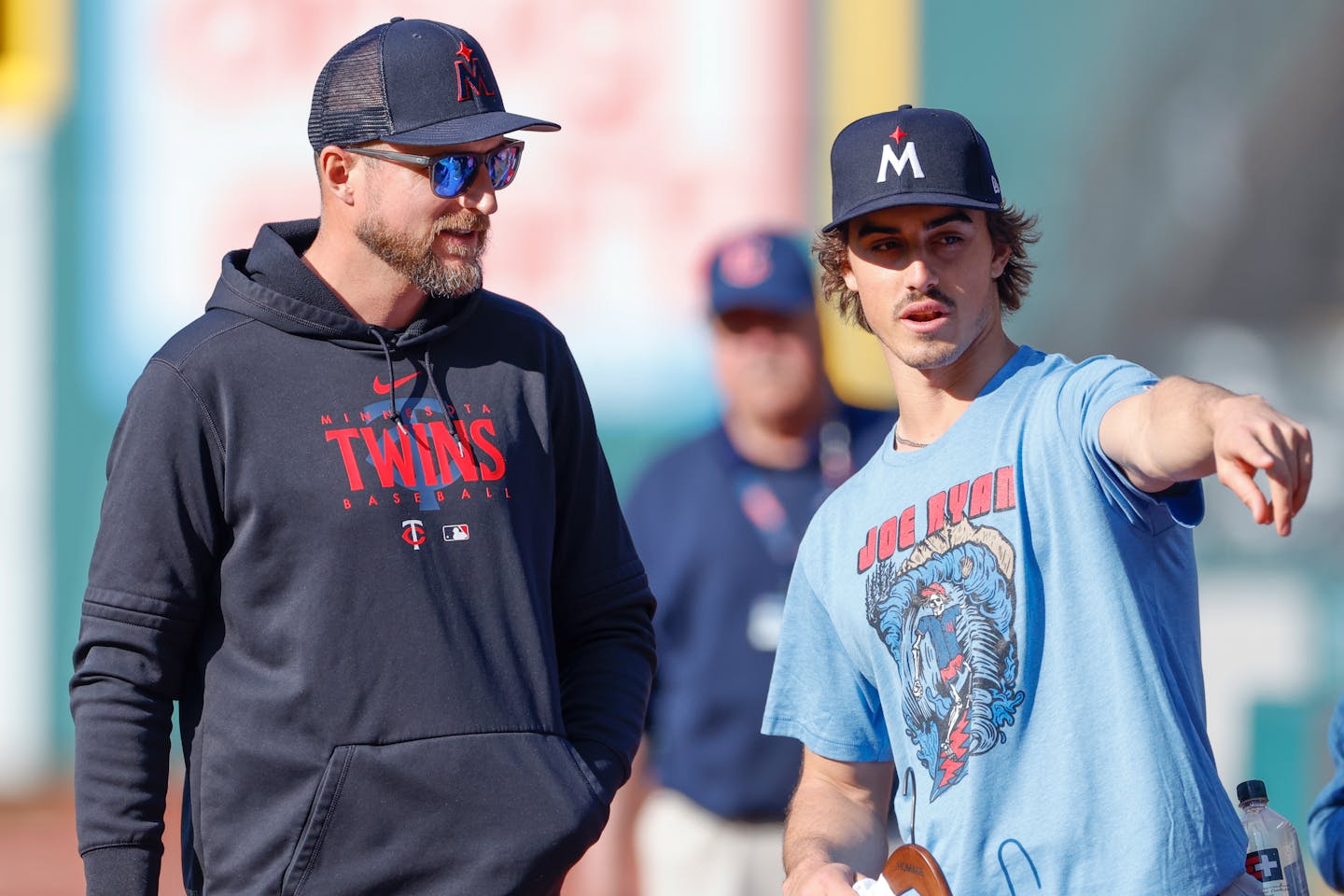 Minnesota Twins' Joe Ryan, right, talks with manager Rocco Baldelli before a baseball game against the Cleveland Guardians, Friday, May 5, 2023, in Cleveland. (AP Photo/Ron Schwane)