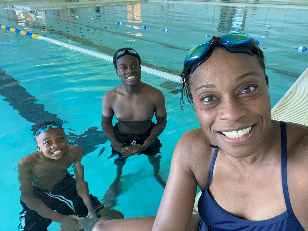 Nisha Botchwey posed with her sons Nicolas, left, and Edward, after lap swimming with them on her birthday last year.