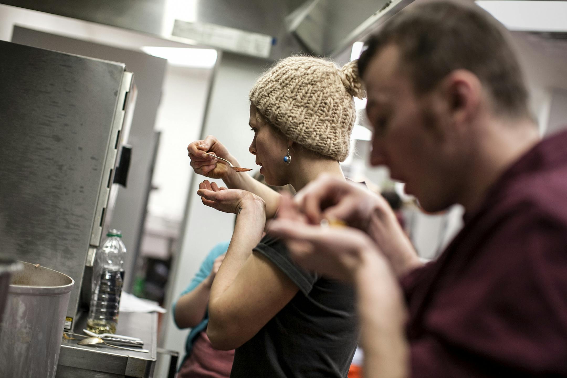 Founder Emily Torgrimson, left, and volunteer Pawel Wroblewski taste-test the posole at Eat for Equity's community feast benefitting Urban Ventures at the Urban Ventures headquarters in Minneapolis January 31, 2015.