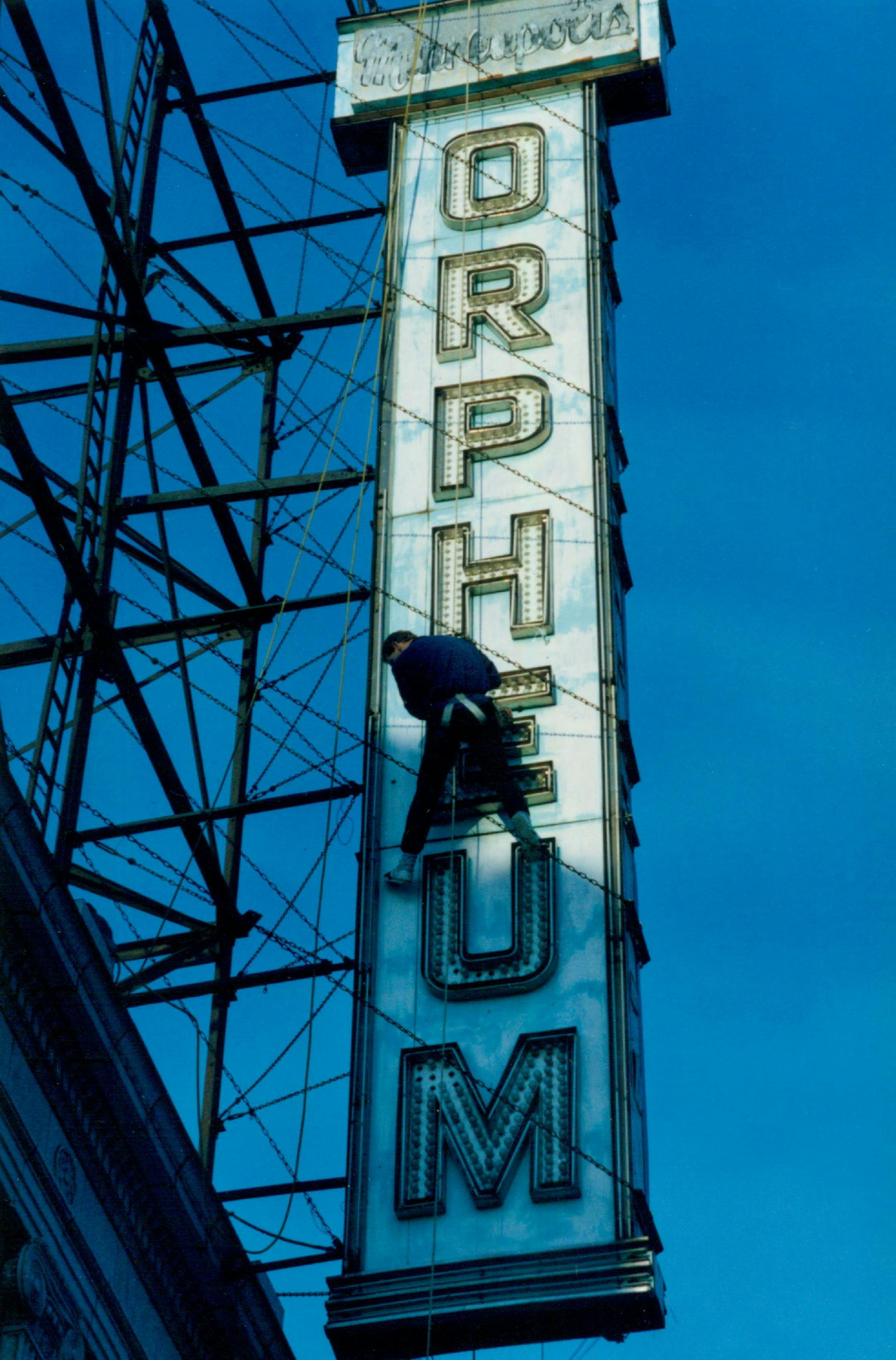 December 31, 1988 Lighting Up -- Bruce Marietta employed rock-climbing technique Friday to change the light bulbs on the sign at the Orpheum Theater on Hennepin Av. in downtown Minneapolis. December 30, 1988 John Croft, Minneapolis Star Tribune