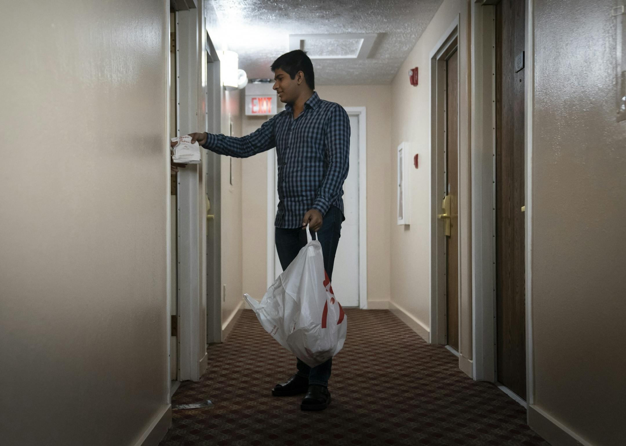 Zahid Memood dropped off Chick-fil-A for homeless people residing at the Chaska Super 8. He was helping out his sister Sana Cheema who is the general manager of the hotel in Chaska, Minn., on Friday, May 15, 2020.