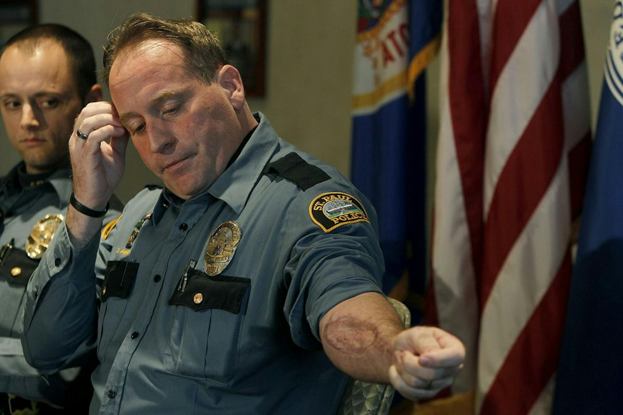 St. Paul police officers Brian Wanschura, left, and Daniel King talked about their fatal October shootout with Chue Xiong during a news conference Thursday.