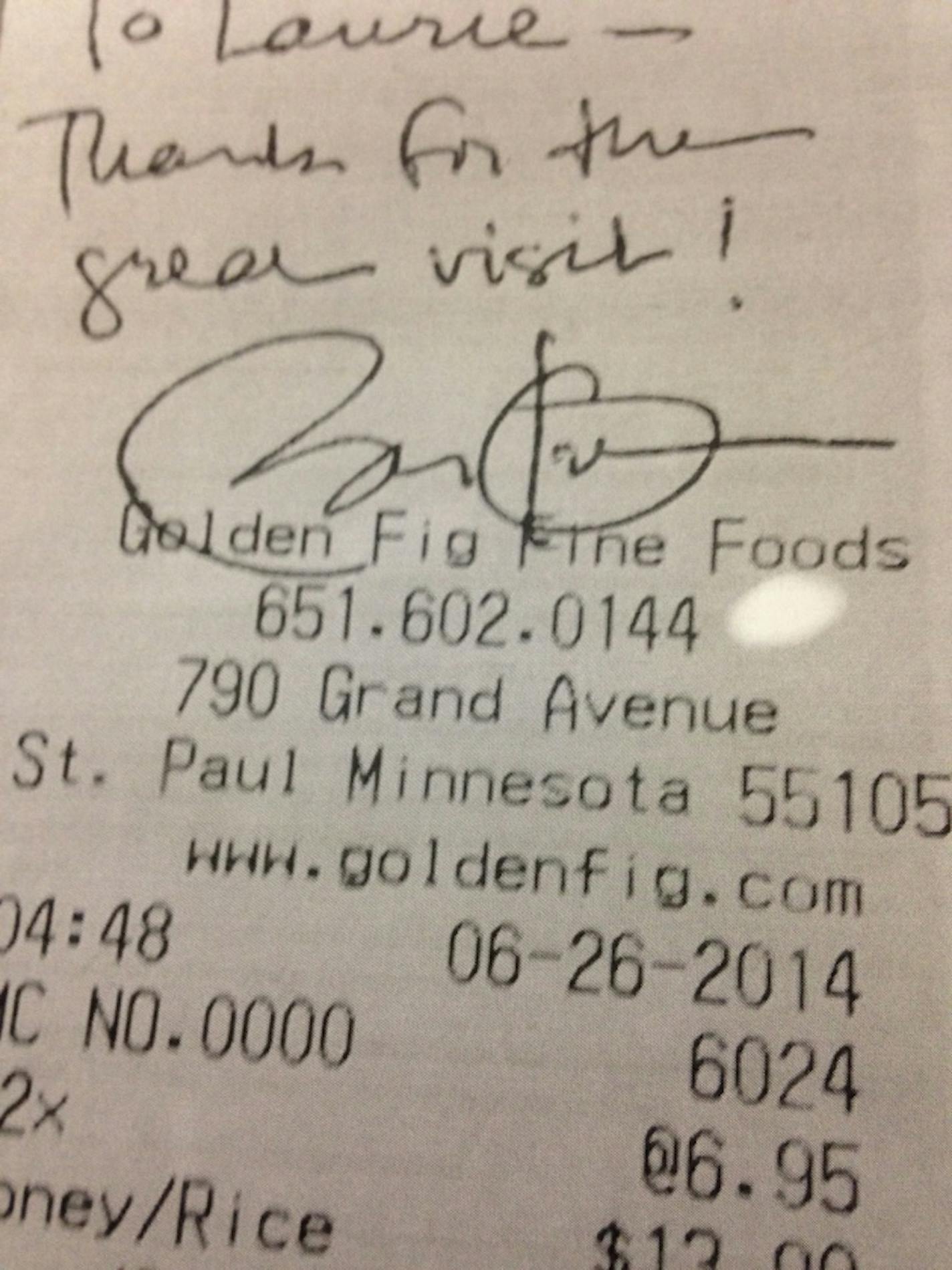 President Obama signed his merchandise receipt for the owner of Golden Fig.