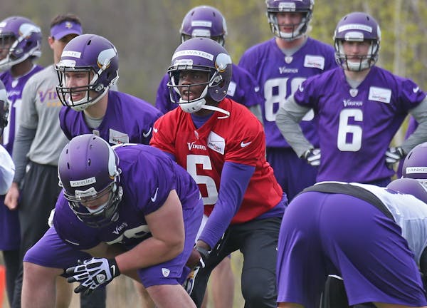 (center) Quarterback Teddy Bridgewater took snaps during the Vikings Rookie Mini Camp at Winter Park on 5/16/14.] Bruce Bisping/Star Tribune bbisping@