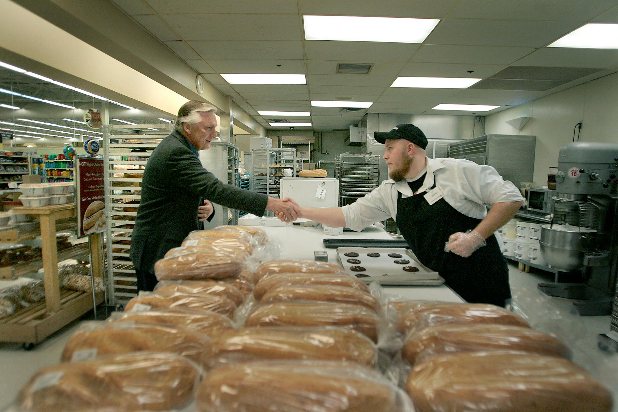 Elwyn Tinklenberg greeted Rainbow Foods worker Jeremy Anges during a campaign stop to support members of United Food and Commercial Workers Local 789 in Forest Lake. The Sixth District congressional race is considered a tossup.