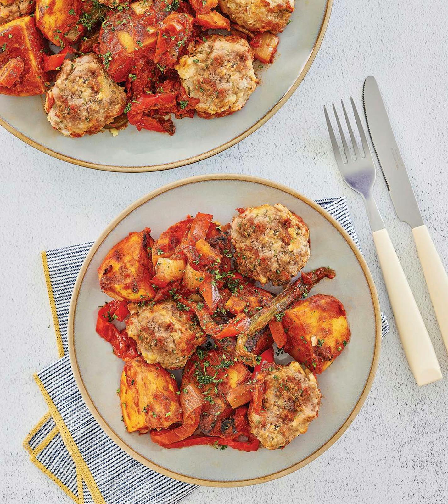 Greek Meatballs with Roast Potatoes, from "The Everything One Pot Mediterranean Cookbook," by Peter Minaki (Simon &amp; Schuster, 2023).Photo credit: James Stefiuk