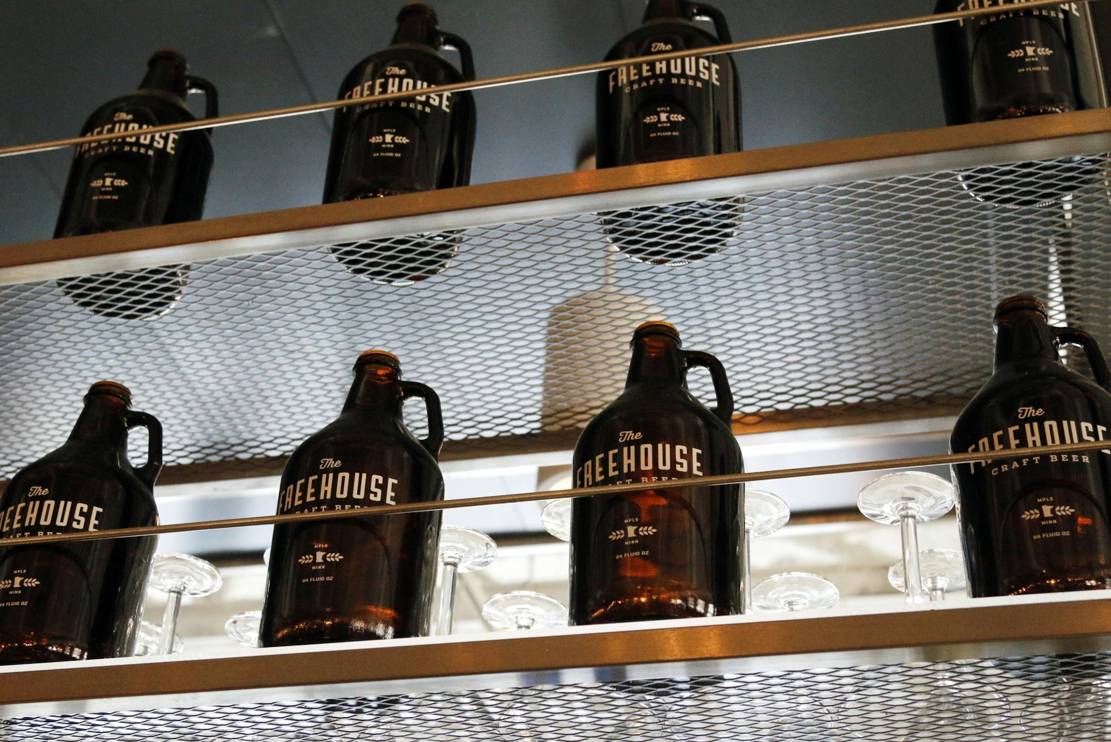Growlers line the shelf above the bar.