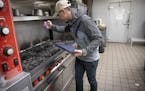 Minnesota Health Department's Food inspector Kevin Keopraseuth inspected a catering establishment, Wednesday, January 23, 2019 in Minneapolis, MN. As 