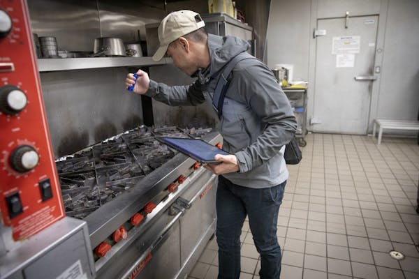 Minnesota Health Department's Food inspector Kevin Keopraseuth inspected a catering establishment, Wednesday, January 23, 2019 in Minneapolis, MN. As 