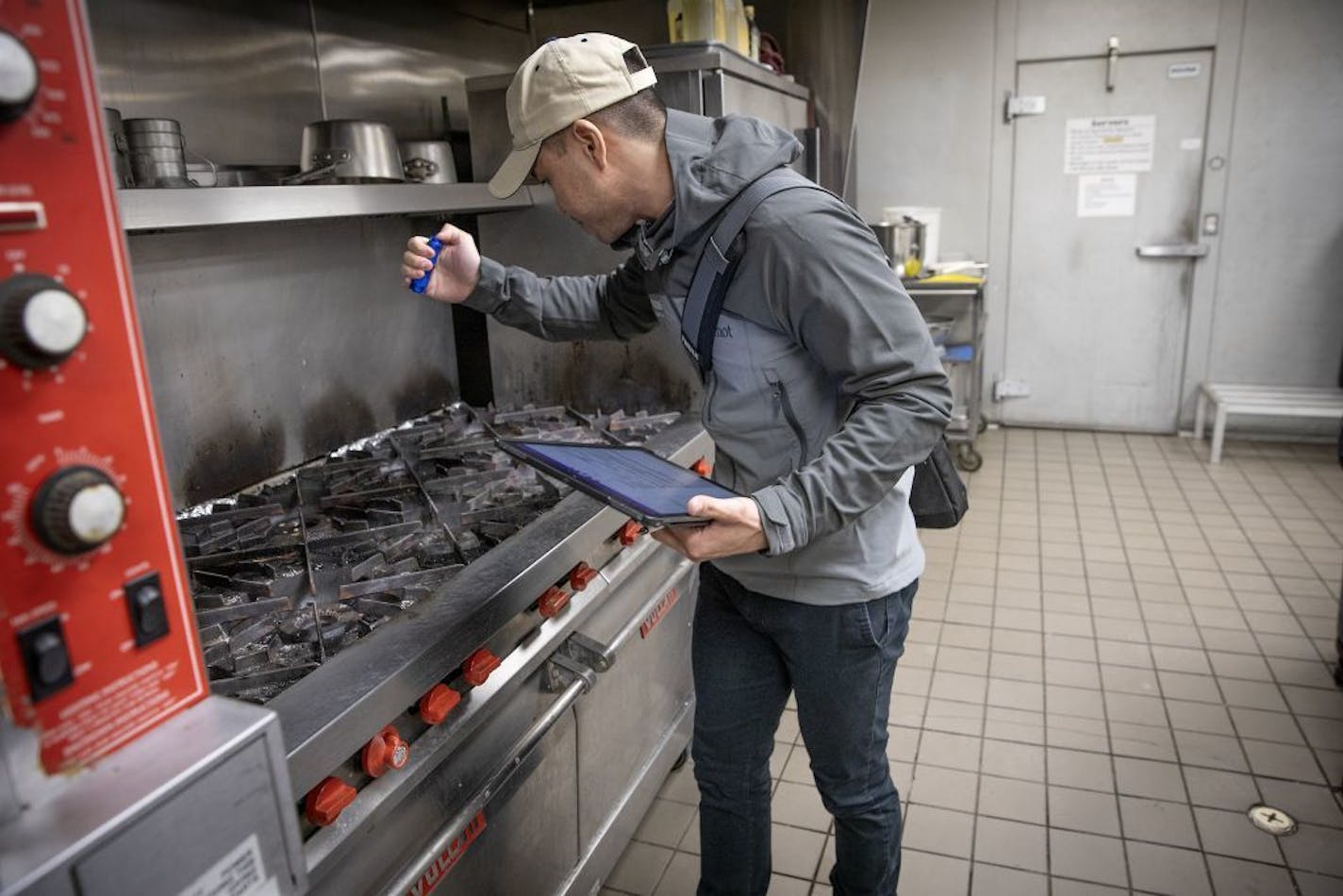 Minnesota Health Department's Food inspector Kevin Keopraseuth inspected a catering establishment, Wednesday, January 23, 2019 in Minneapolis, MN. As more health departments post restaurant inspections online, Minnesota remains one of just three states where no government entities publish the data.