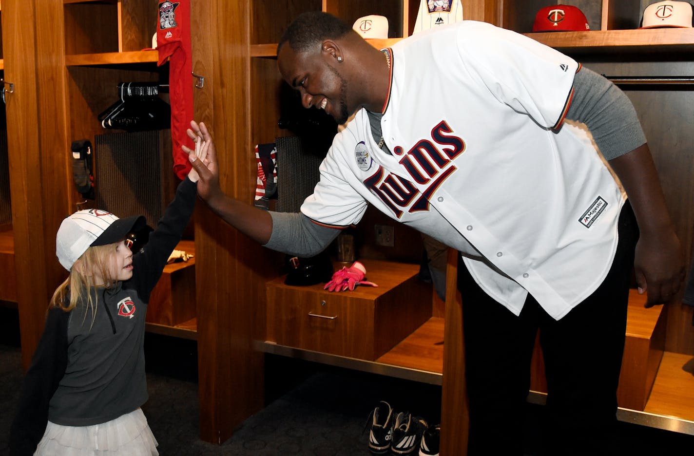 Minnesota Twins' Michael Pineda greets a young fan during the baseball team's TwinsFest on Friday, Jan. 19, 2018 in Minneapolis. (AP Photo/Hannah Foslien)