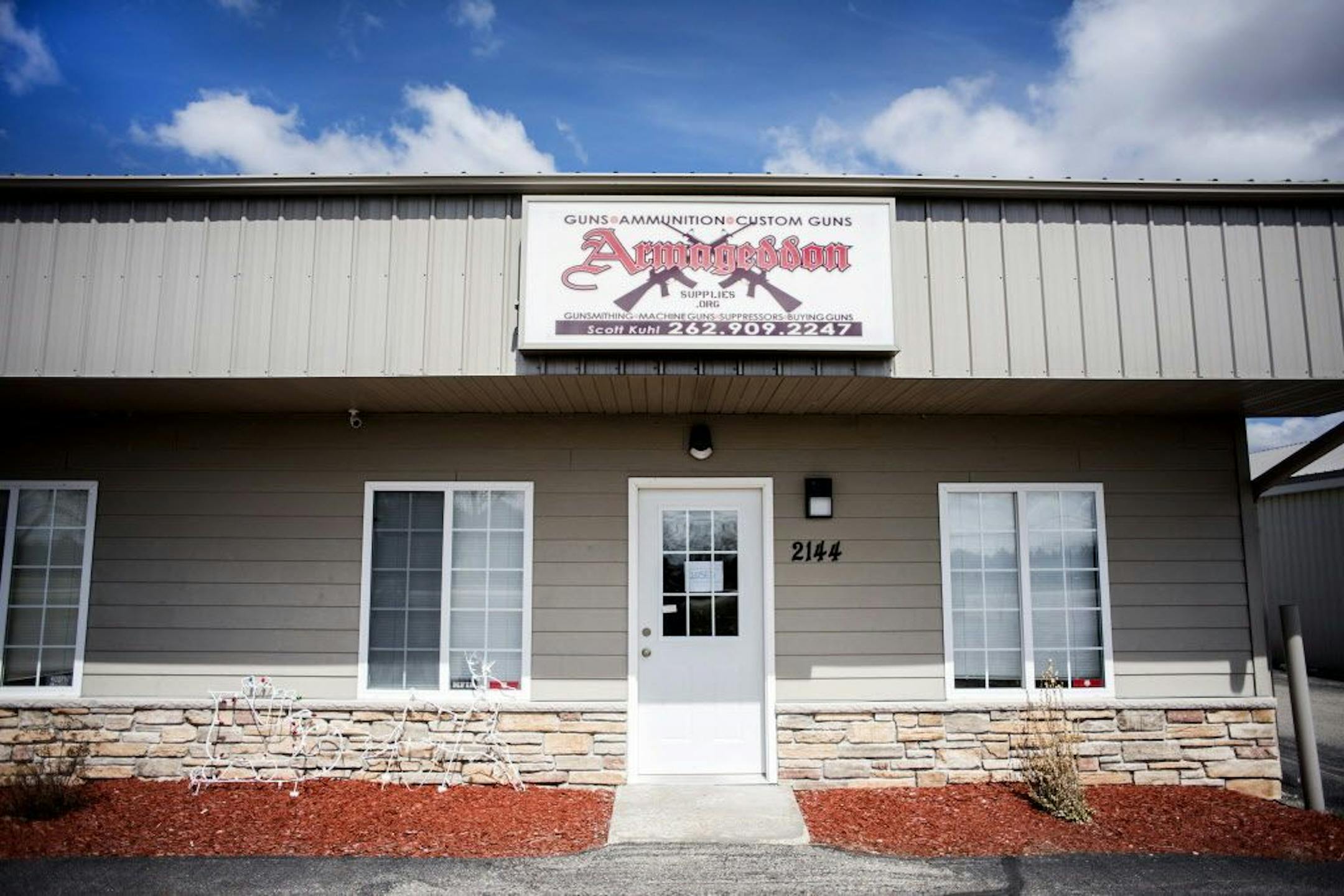 This Thursday, April 6, 2017 photo shows the exterior of Armageddon Gun Shop in Janesville, Wis. A manhunt was underway Friday for Joseph Jakubowski, suspected of stealing firearms from the southern Wisconsin gun store, threatening an unspecified attack that prompted several schools to close, and sending an anti-government manifesto to President Donald Trump.