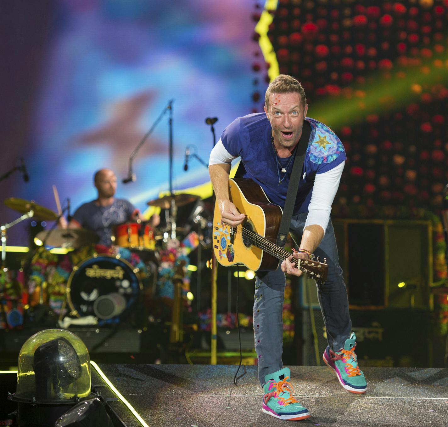 Chris Martin of Coldplay performs at Metlife Stadium on Tuesday, Aug. 1, 2017, in East Rutherford, N.J. (Photo by Scott Roth/Invision/AP)