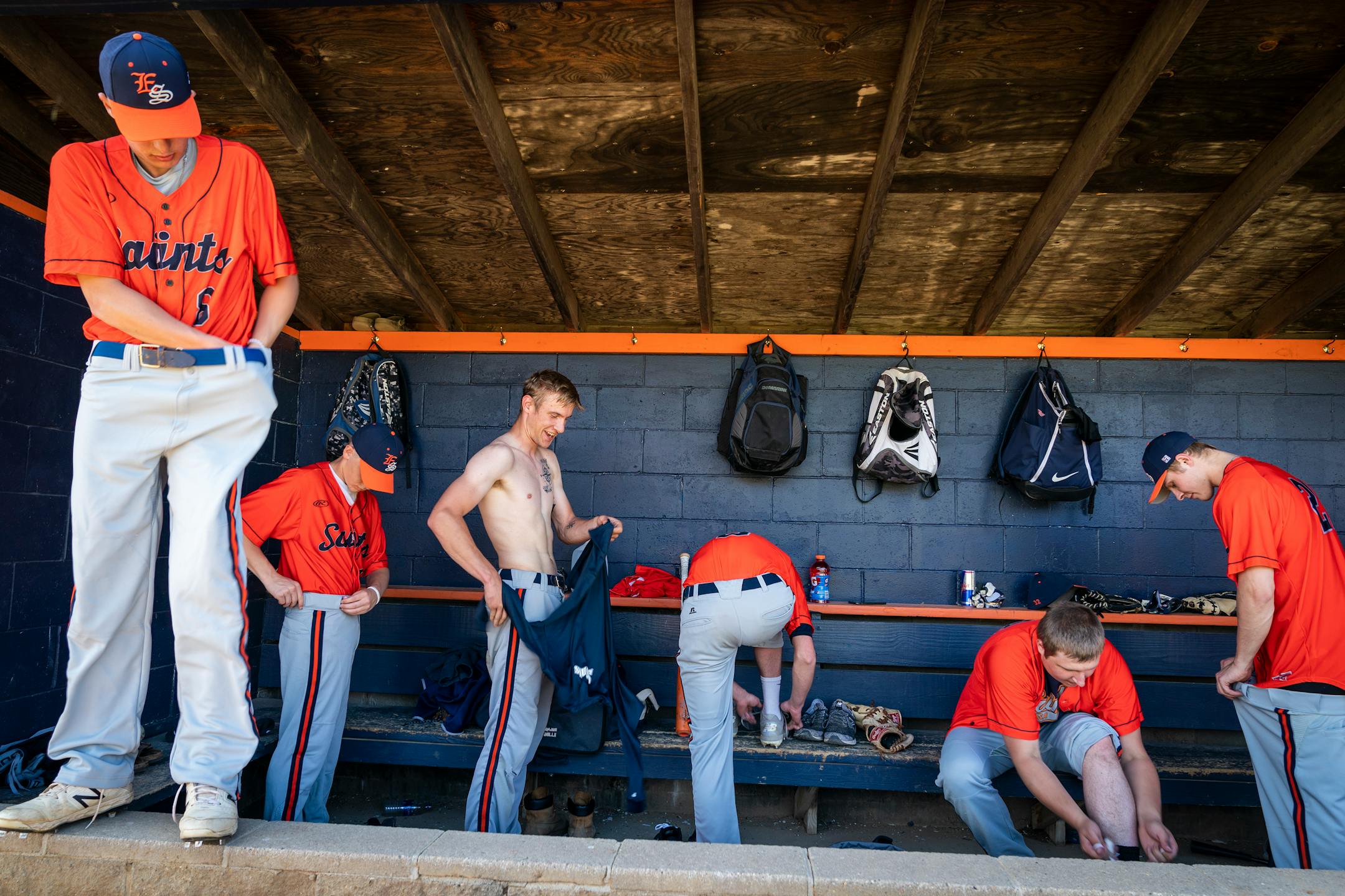The Elrosa Saints changed into their uniforms in the dugout before Friday's Stearns County League game against the Cold Spring Rockies, before Gov. Tim Walz had cleared amateur townball teams to play because of coronavirus concerns