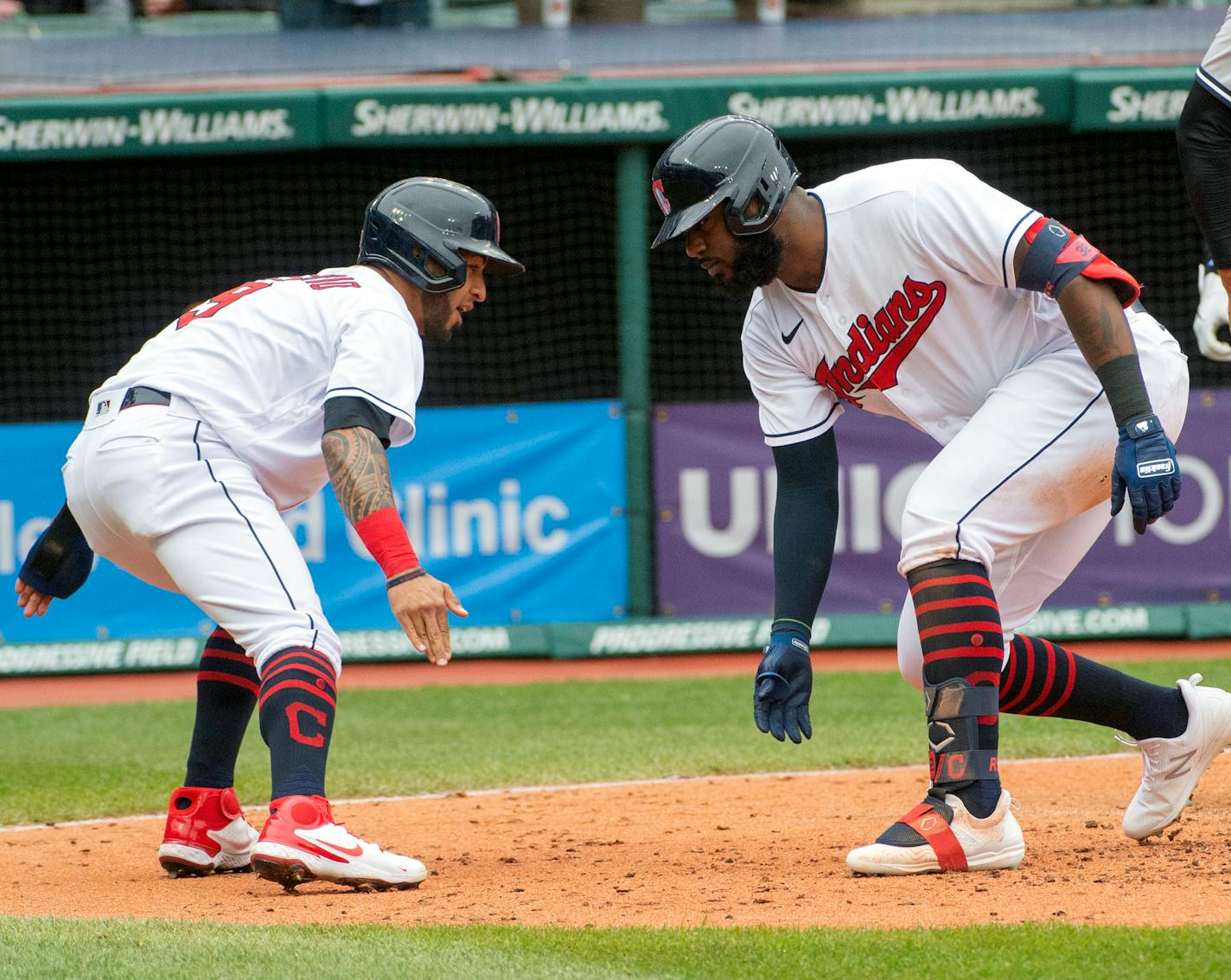 Cleveland Indians' Eddie Rosario, left, congratulates Franmil Reyes who hit a three-run home run off New York Yankees starting pitcher Jameson Taillon during the fourth inning of a baseball game in Cleveland, Sunday, April 25, 2021. (AP Photo/Phil Long)