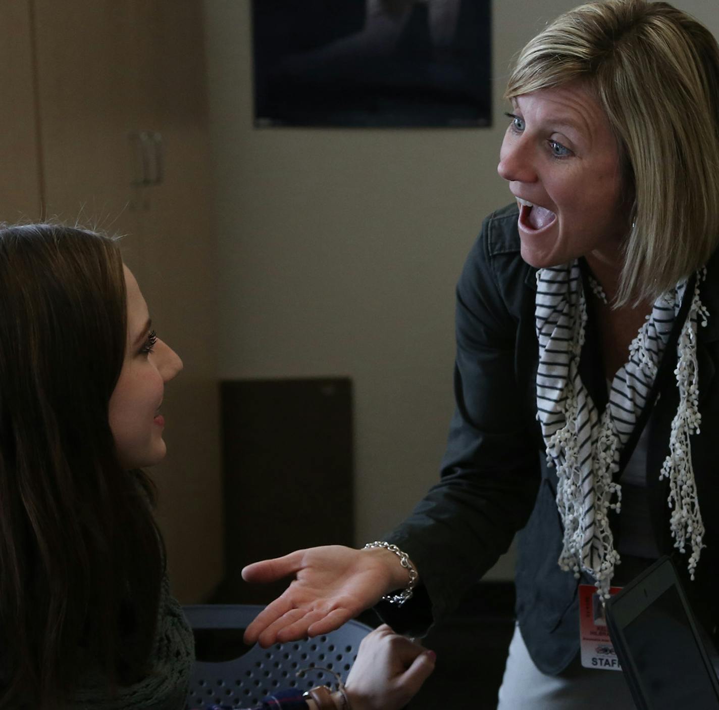 Teacher Kelly Hilbrands talked with Danika Guenther and her group about the next question to discuss as they worked on a collaborative project for college psychology class. ] (KYNDELL HARKNESS/STAR TRIBUNE) kyndell.harkness@startribune.com At Alexandria Area High School in Alexandria Min., Tuesday, April 21, 2015.