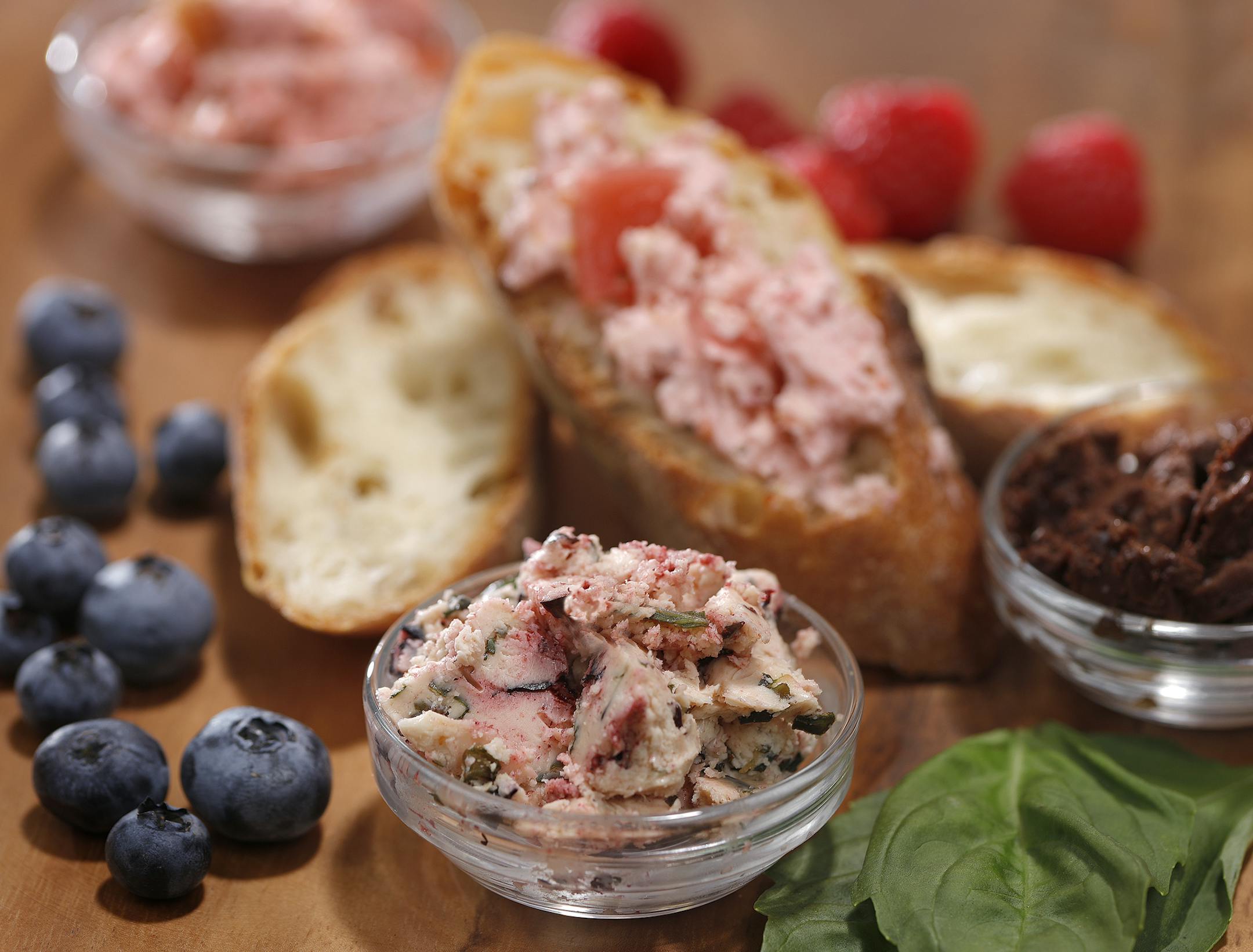 Make your own flavored butters, such as these from Rustica Bakery: From top (on bread) and clockwise: Raspberry With Pickled Rhubarb, Chocolate (see recipe) and Blueberry Basil.