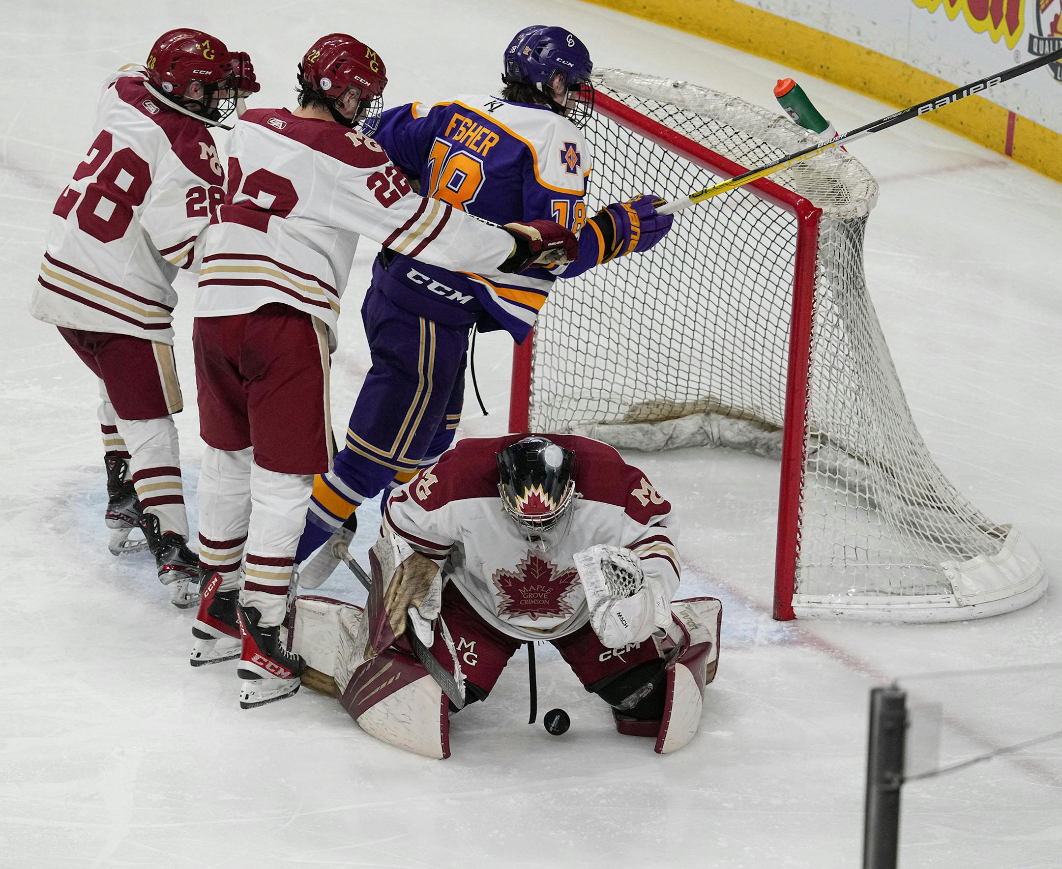 Maple Grove goaltender Jack Roach (1) with a save in the third period.