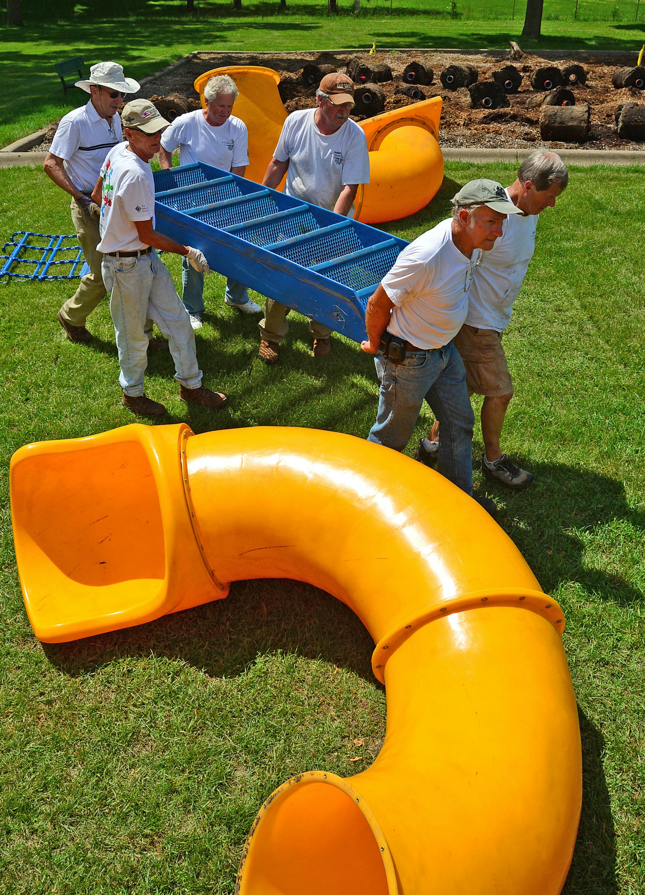 Volunteers dismantled playgrounds in Brooklyn Park to be donated to a group called Kids Around the World, a nonprofit that brings second-hand playground equipment to third world countries. These volunteers were working at Brookdale Park, 7650 June Avenue in Brooklyn Park. This playground was headed to Africa ]Richard.Sennott@startribune.com Richard Sennott/Star Tribune Brooklyn Park Minn. Tuesday 6/24/2014) ** (cq)
