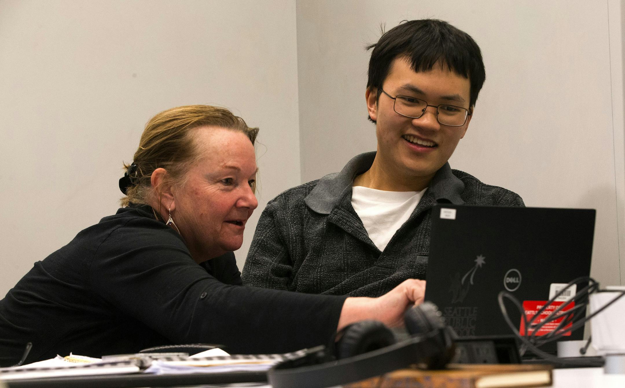 Teacher Maggie Meister, with Seattle Public Schools, helps Alan Chen during a class at the University of Washington as part of the Project Search program for students with autism. (Ellen M. Banner/Seattle Times/TSN)