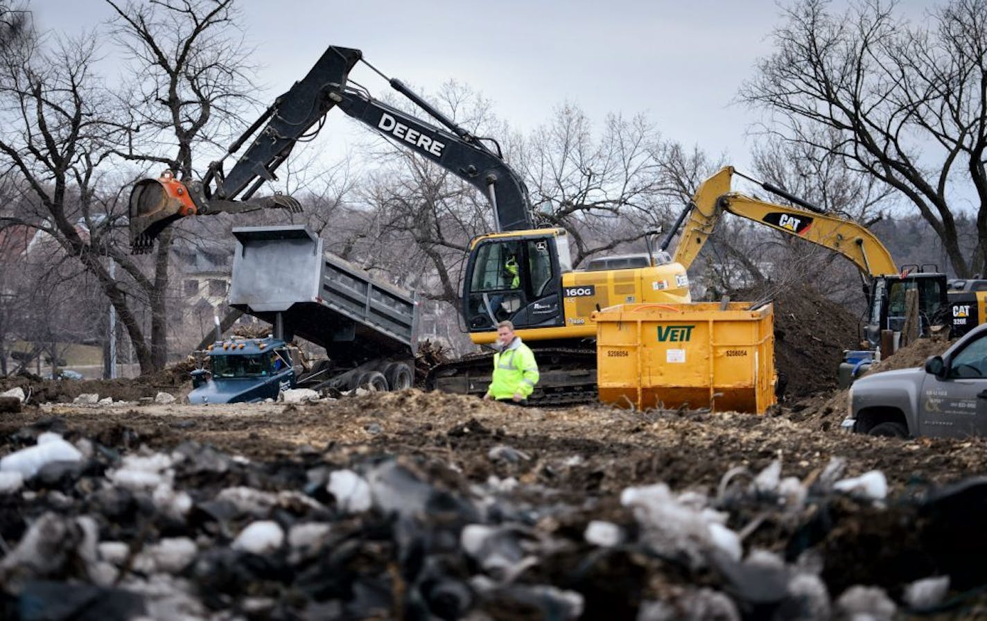 A project supervisor from the builder Kraemer & Sons kept visotors away from the demolition site at 2505 E Lake of the Isles Parkway.