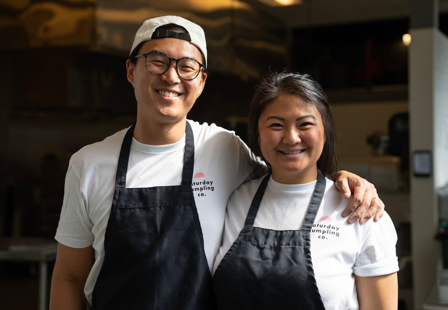 Peter Bian and Linda Cao, co-founders of Saturday Dumpling Co., left to right, pose for a portrait Thursday, May 11, 2023, at Dots Gray Kitchen in Minneapolis.