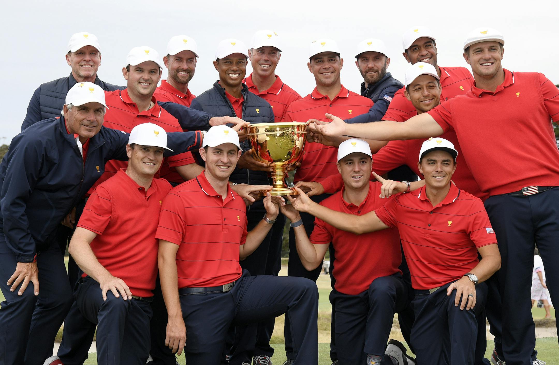 The U.S. team hold their trophy after they won the President's Cup golf tournament at Royal Melbourne Golf Club in Melbourne, Sunday, Dec. 15, 2019. The U.S. team won the tournament 16-14. (AP Photo/Andy Brownbill)