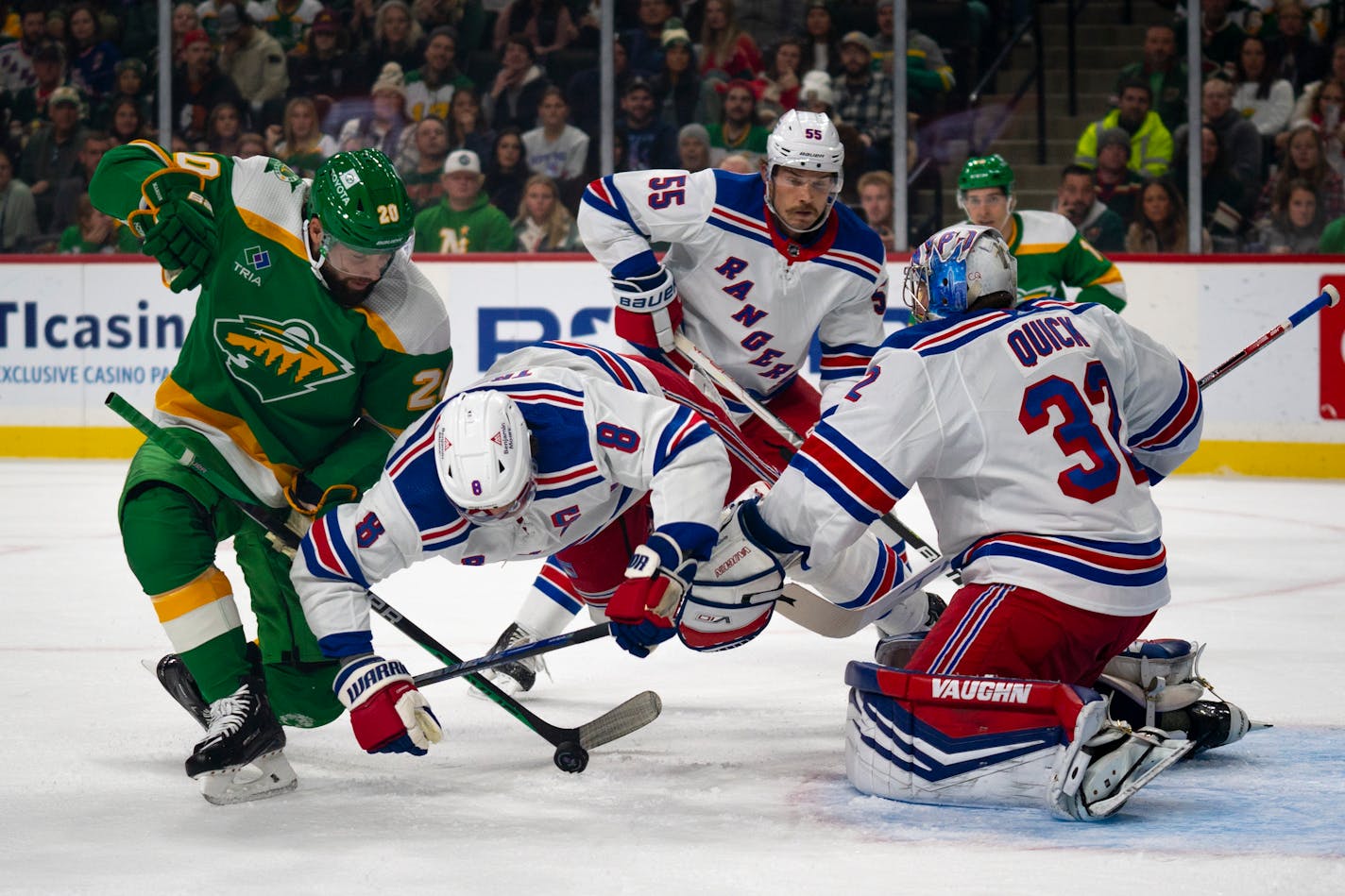 New York Rangers defenseman Jacob Trouba dove over the puck to block it from the goal in the first period Saturday against the Wild.