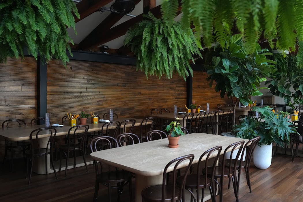 The lush upper level of Gai Noi. The Minneapolis restaurant also includes a rooftop patio, mezzanine private dining area and a large main-level dining room.