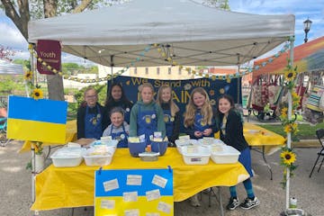 Standing in unity: from left, Shea Engle, Alanna Flynn, Lily Jacobson (seated), Camille Hohman, Grace Prose, Cammie Sammon, Mary Lou Street