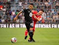 Minnesota United midfielder Emanuel Reynoso evades a Toluca FC player during Leagues Cup play on Aug. 8, 2023, at Allianz Field.
