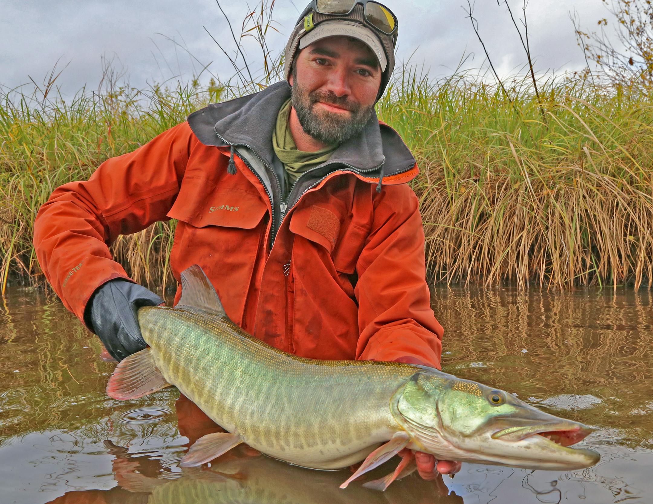 Fishing guide Gabe Schubert held a muskie Dennis Anderson caught last week on a fly. The fish was released unharmed.