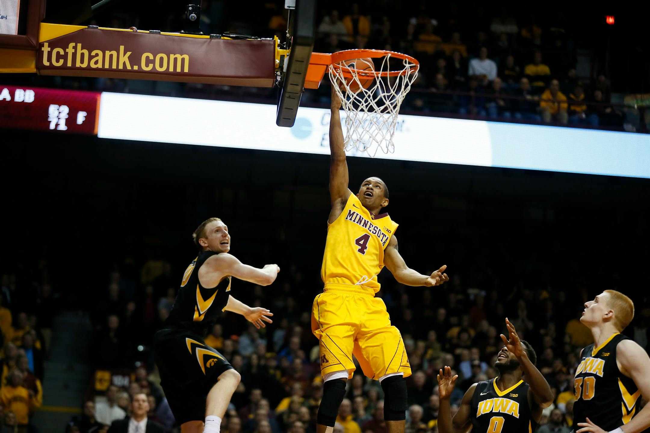 Minnesota Gophers guard DeAndre Mathieu (4) put up a shot on the Iowa defense with not time on the clock Tuesday at Williams Arena. The Gophers lost 77-75.