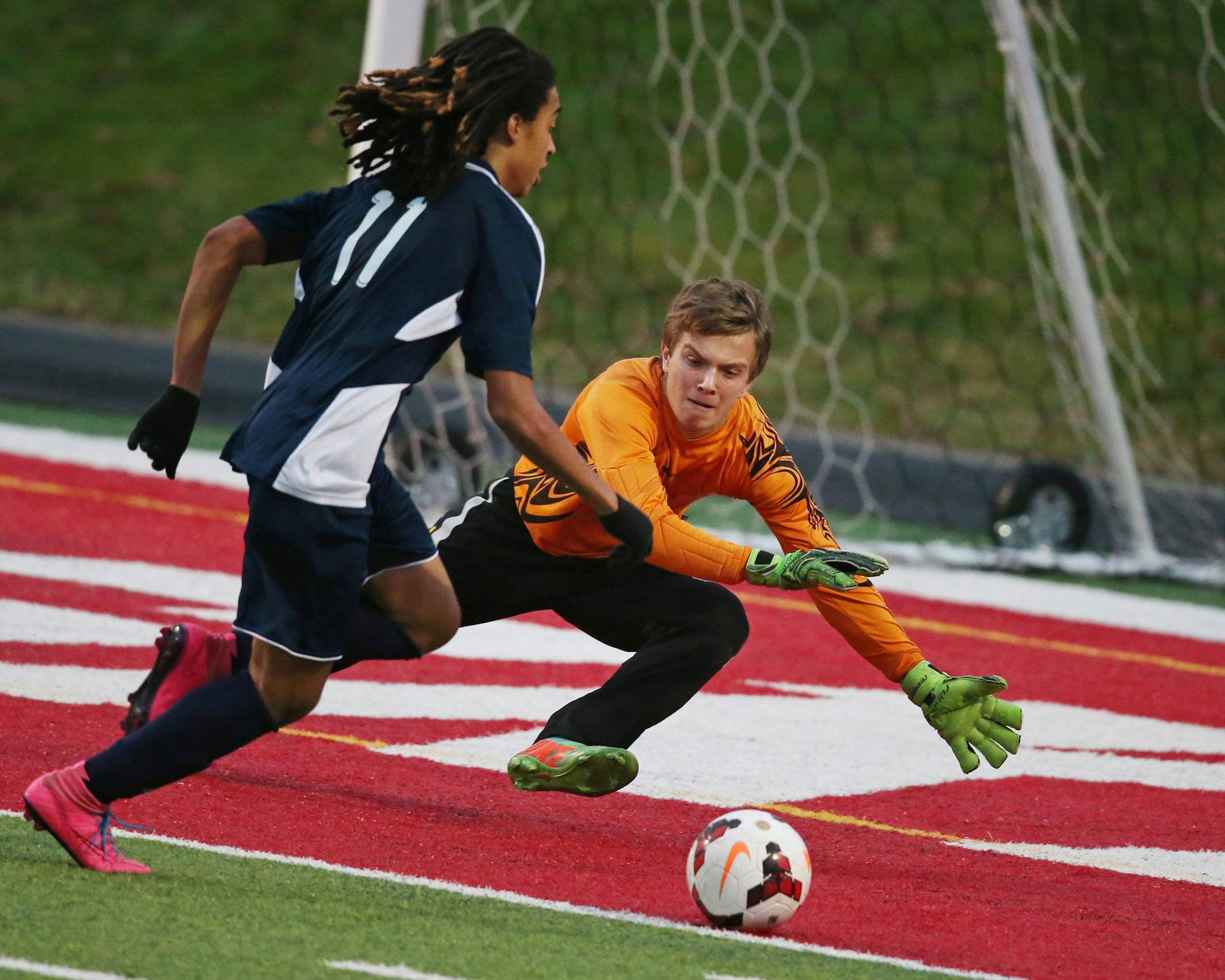Breckís Avi Eller scored a goal in the second half on St. Thomas goal keeper Matthew Wahl Wednesday at Husky Stadium November 4, 2015 in St. Cloud, MN. ] Breck beat St. Thomas Academy 2-0 in boyís class 1-A state tournament semi final soccer action at Husky Stadium. Jerry Holt/ Jerry.Holt@Startribune.com