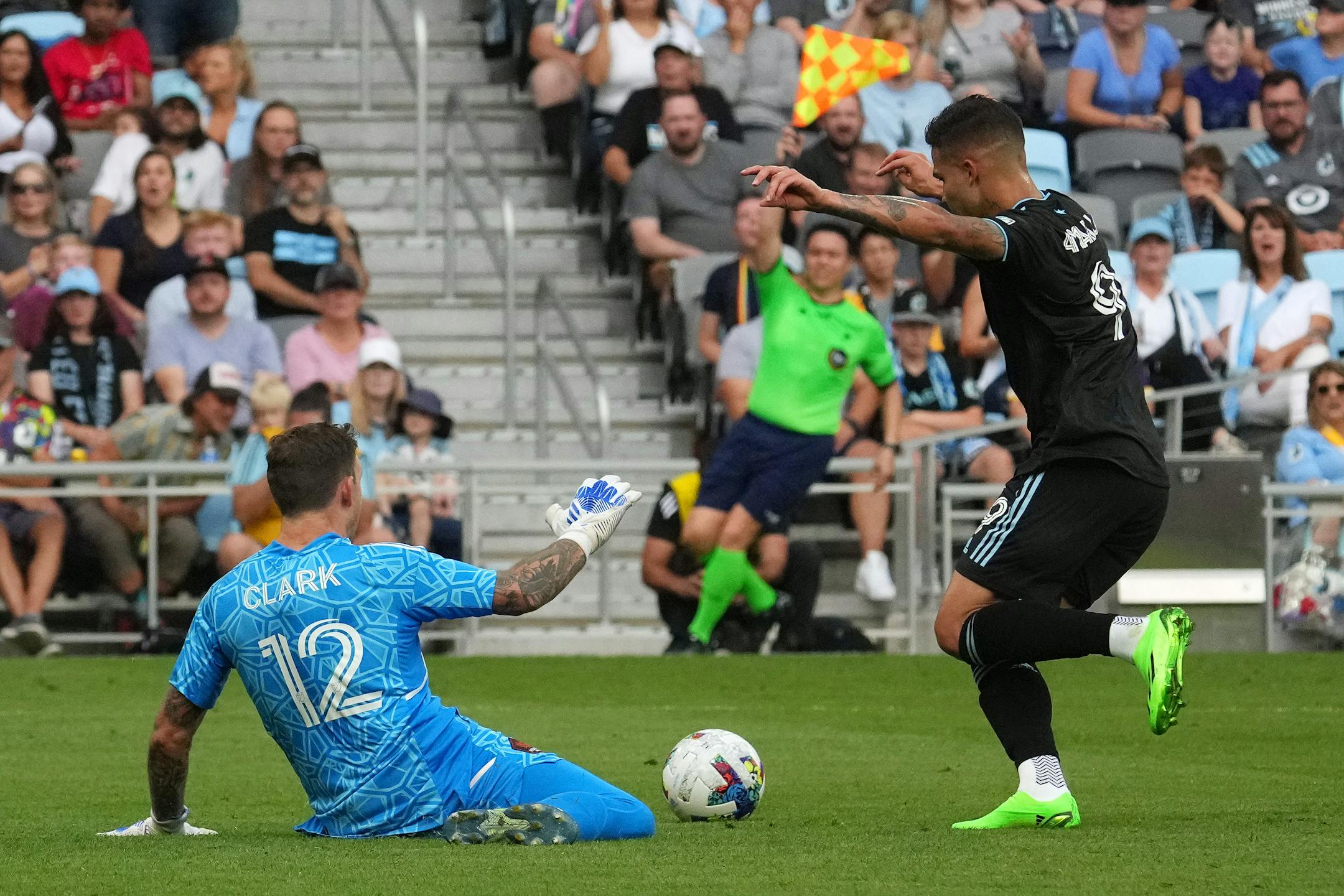 Minnesota United forward Luis Amarilla (9) is called off sides as he makes a move around Houston Dynamo goalkeeper Steve Clark (12) in the second half of an MLS game between Minnesota United and the Houston Dynamo.