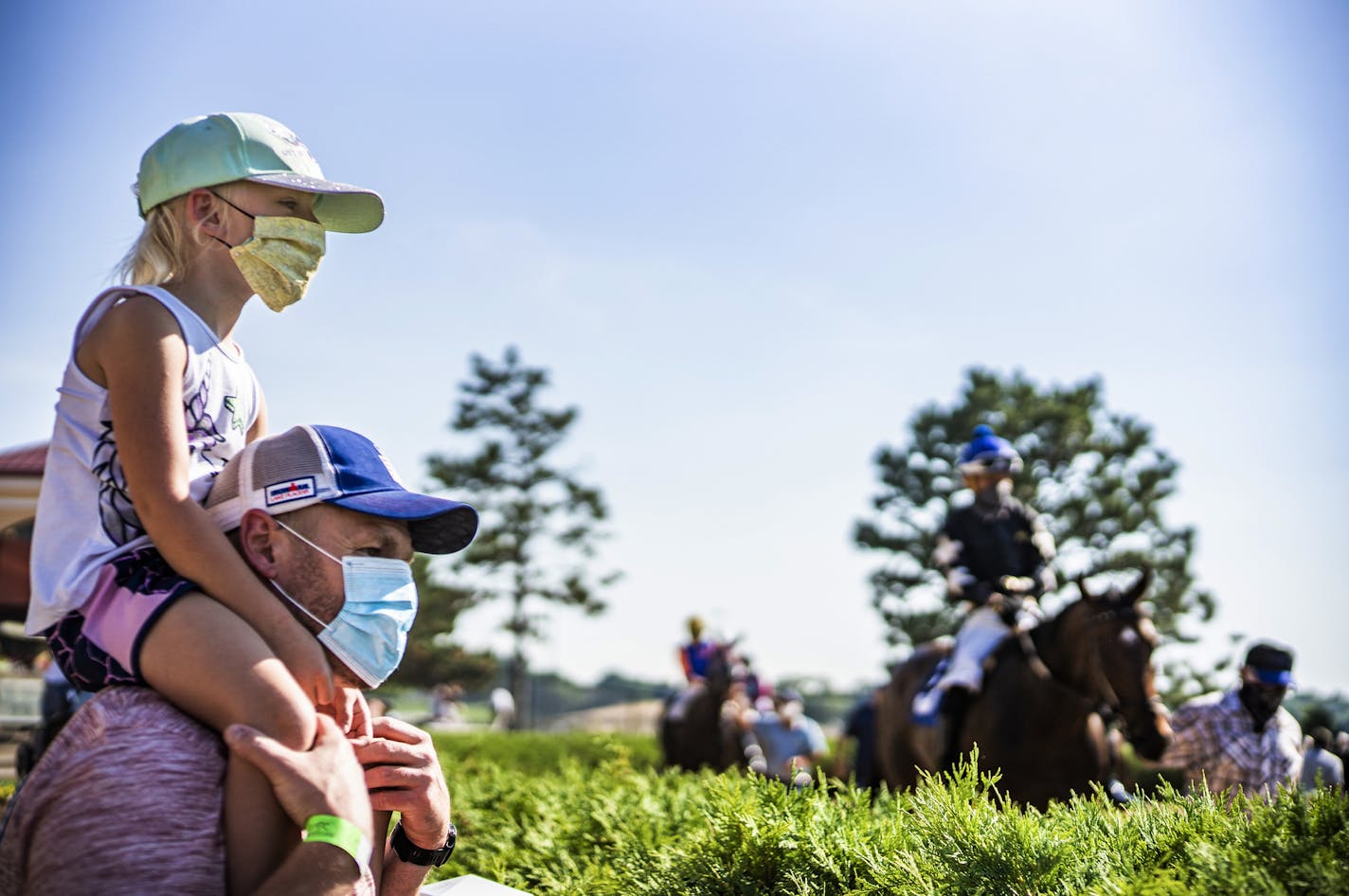 Jeremy Doden and his daughter Audrey, 5, checked out the horses in the paddock. Canterbury Park lets in about 750 fans, which is 10 percent or so of a usual busy night during normal times.