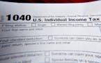 Part of a 1040 federal tax form. The IRS began accepting tax returns on Feb. 12.