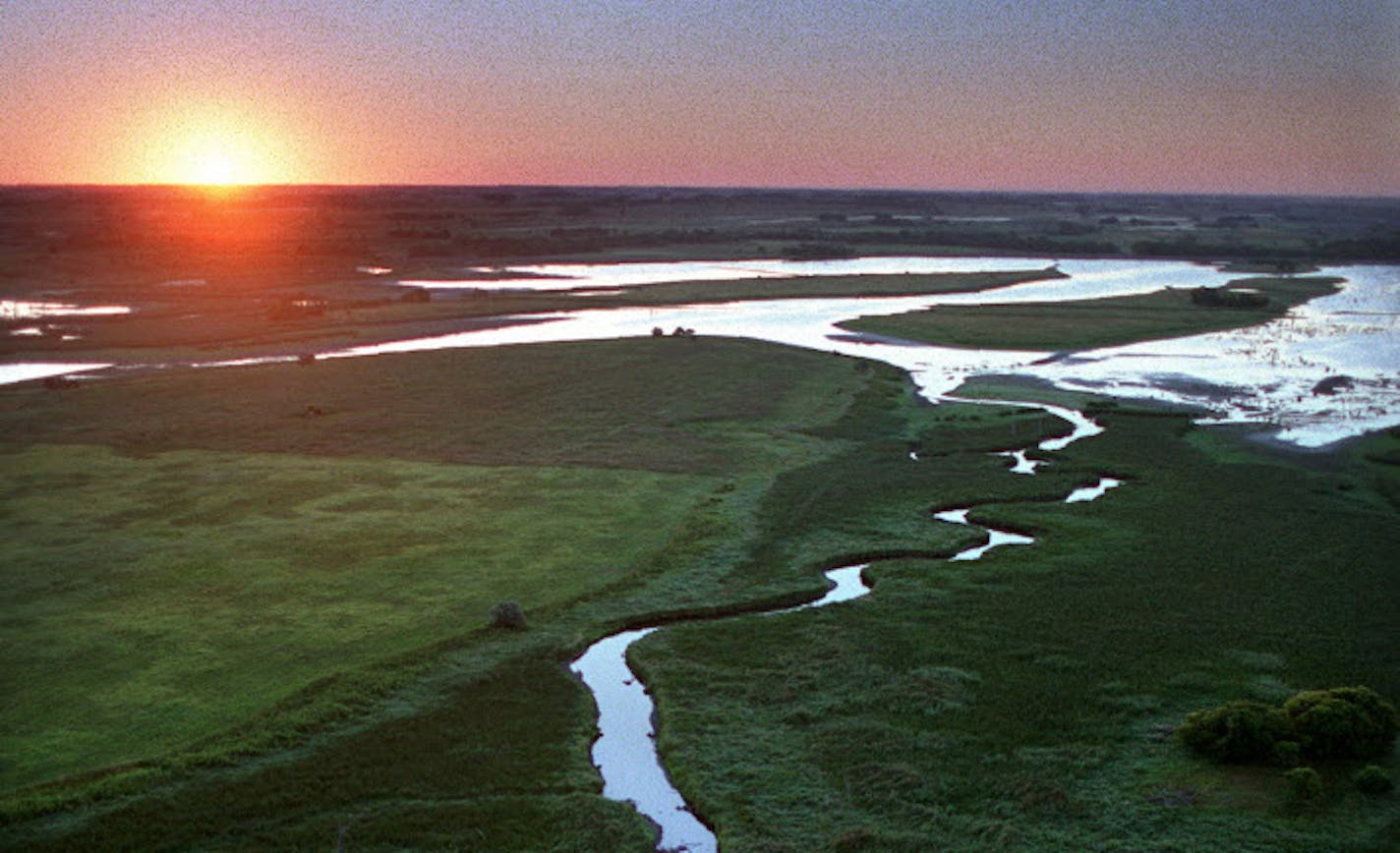 Near its headwaters, the Minnesota River is a beautiful place. Here, it winds through Big Stone National Wildlife Refuge southeast of Ortonville; the refuge serves as a major waterfowl production and migration area and contains more than 6,000 acres of grassland, including large tracts of native prairie.