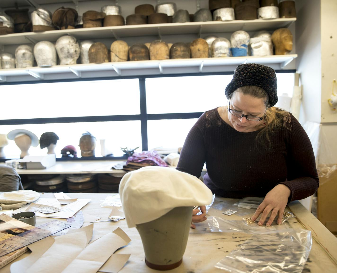 Costume crafts artisan Sam Haddow organized some equipment as she worked on hats (mostly caps) that are part of the production of Indecent at the Guthrie Theater on Friday, January 12, 2018, in Minneapolis, Minn. ] RENEE JONES SCHNEIDER &#x2022; renee.jones@startribune.com