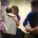 Angela Champagne-From hugged her best friend Krysti Clark-Garber after she spoke to a group of people as part of her Fight Like a Girl campaign at Cit