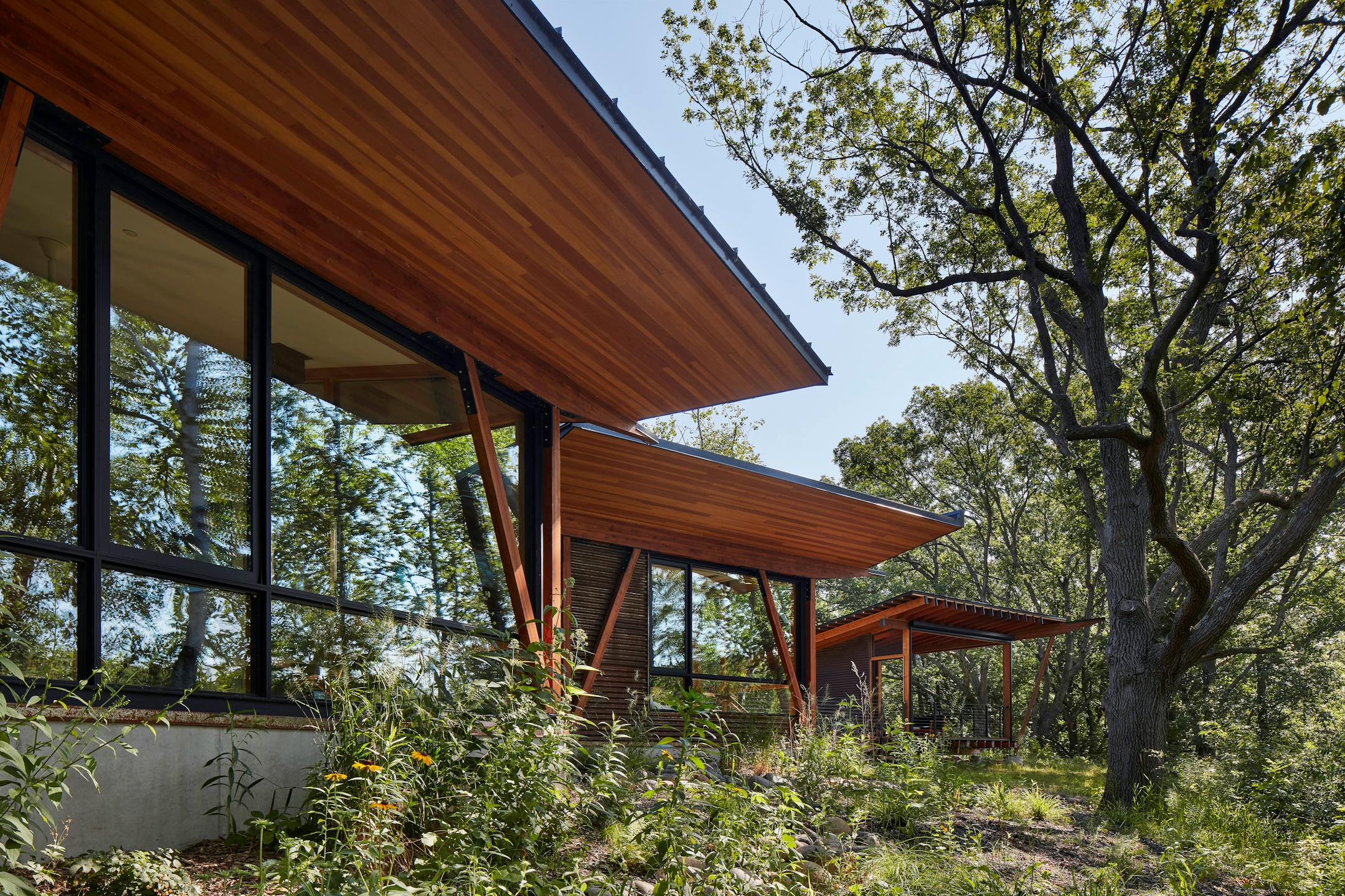 Set against a backdrop of rolling hills and prairie, SALA Architect's Home of the Month winning retreat is an restorative getaway in Frederic, Wis. that also restores the land.