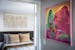 A painting by Meg Lionel Murphy hangs in the hallway while a woven piece from Kristen Thompson and airy Faribault Mill accents go with the vibe in Iya