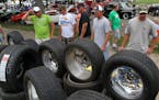 People looked over new tires and rims during the Car Craft Summer Nationals. Cars of all years, makes and horsepower toured the Minnesota State Fairgr