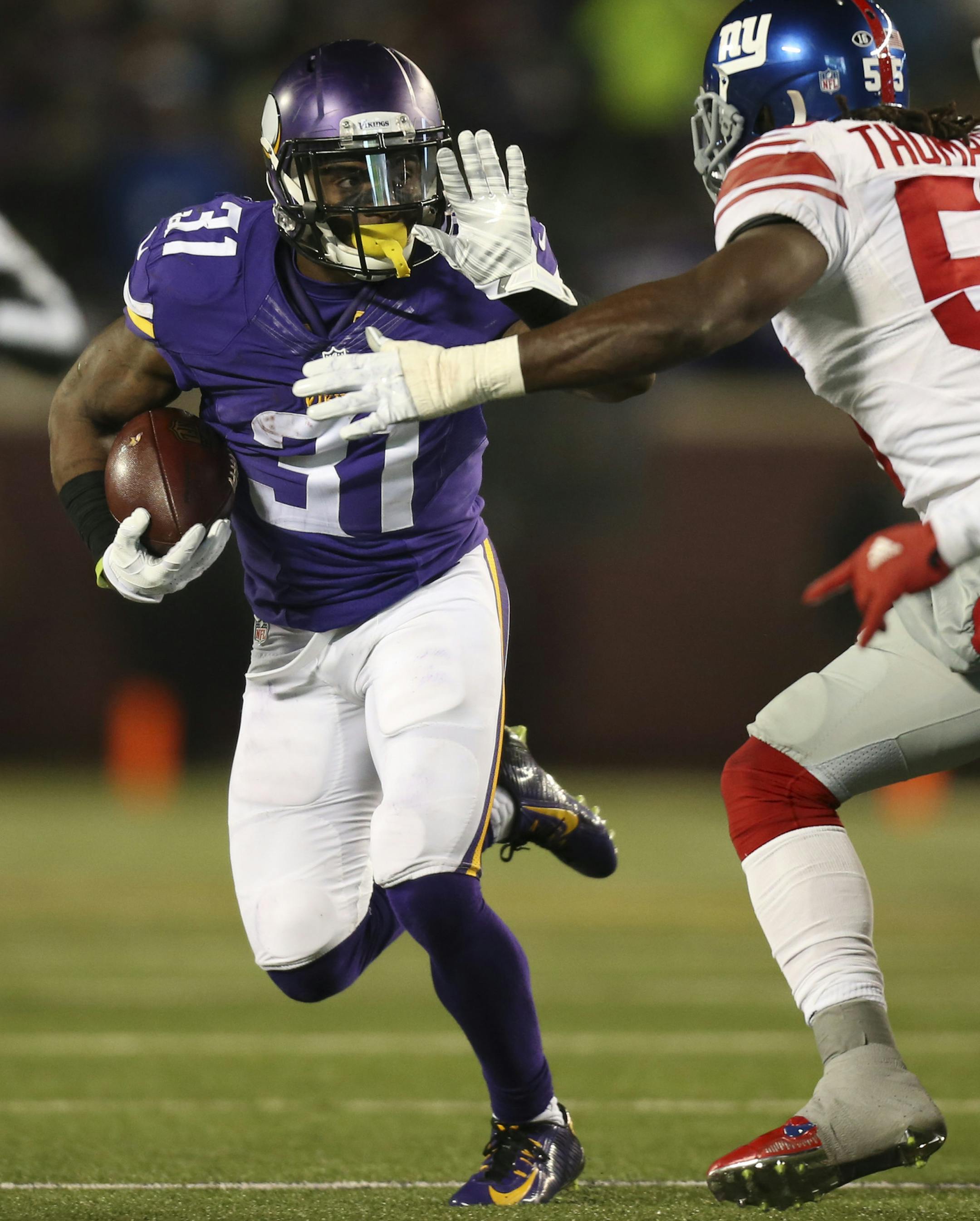 Vikings running back Jerick McKinnon (31) prepared to stiff arm Giants outside linebacker J.T. Thomas (55) while gaining 2 yards in the third quarter Sunday night. ] JEFF WHEELER &#xef; jeff.wheeler@startribune.com The Minnesota Vikings faced the New York Giants in an NFL football game Sunday night, December 27, 2015 at TCF Bank Stadium in Minneapolis.
