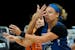 Phoenix Mercury guard Diana Taurasi, background, blocks Minnesota Lynx guard Rachel Banham's vision during the first half of a WNBA playoff basketball