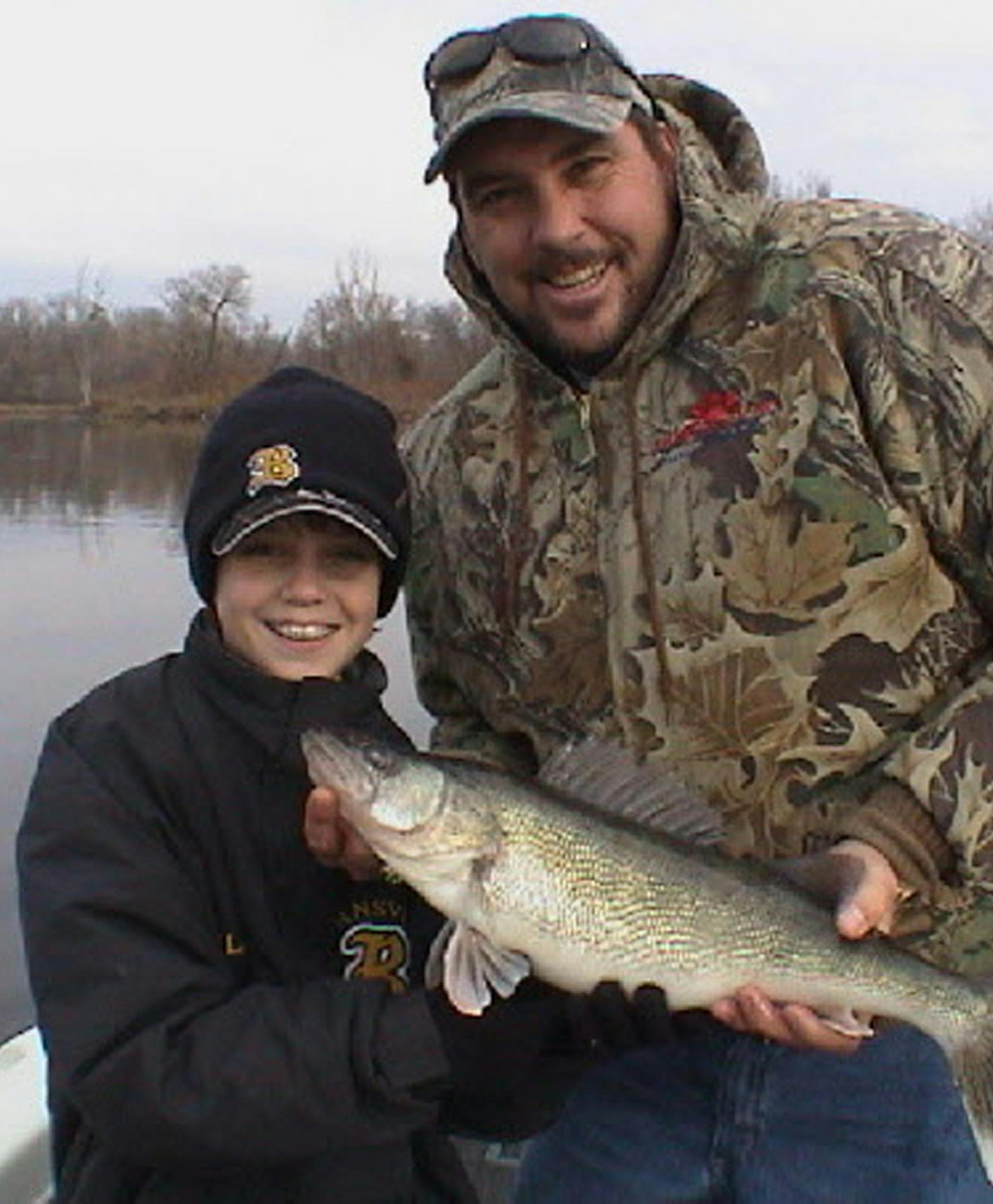 Retired Minnesota Twins great Kent Hrbek and friend with a walleye. ORG XMIT: MIN2014052108285694