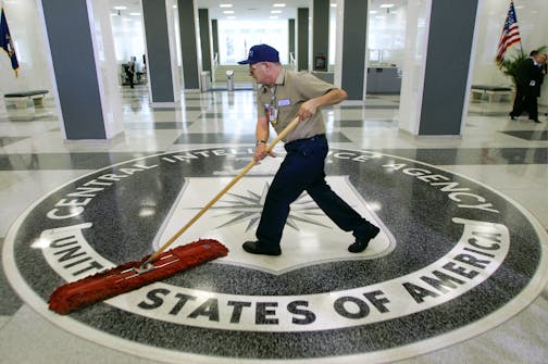 FILE - In this March 3, 2005 file photo, a workman slides a dustmop over the floor at the Central Intelligence Agency headquarters in Langley, Va. President Barack Obama has ordered intelligence officials to conduct a broad review of election-season cyberattacks, including the email hacks that rattled the presidential campaign and raised fresh concerns about Russia's meddling in U.S. elections, the White House said Friday. (AP Photo/J. Scott Applewhite)