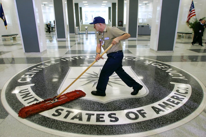 FILE - In this March 3, 2005 file photo, a workman slides a dustmop over the floor at the Central Intelligence Agency headquarters in Langley, Va. President Barack Obama has ordered intelligence officials to conduct a broad review of election-season cyberattacks, including the email hacks that rattled the presidential campaign and raised fresh concerns about Russia's meddling in U.S. elections, the White House said Friday. (AP Photo/J. Scott Applewhite)