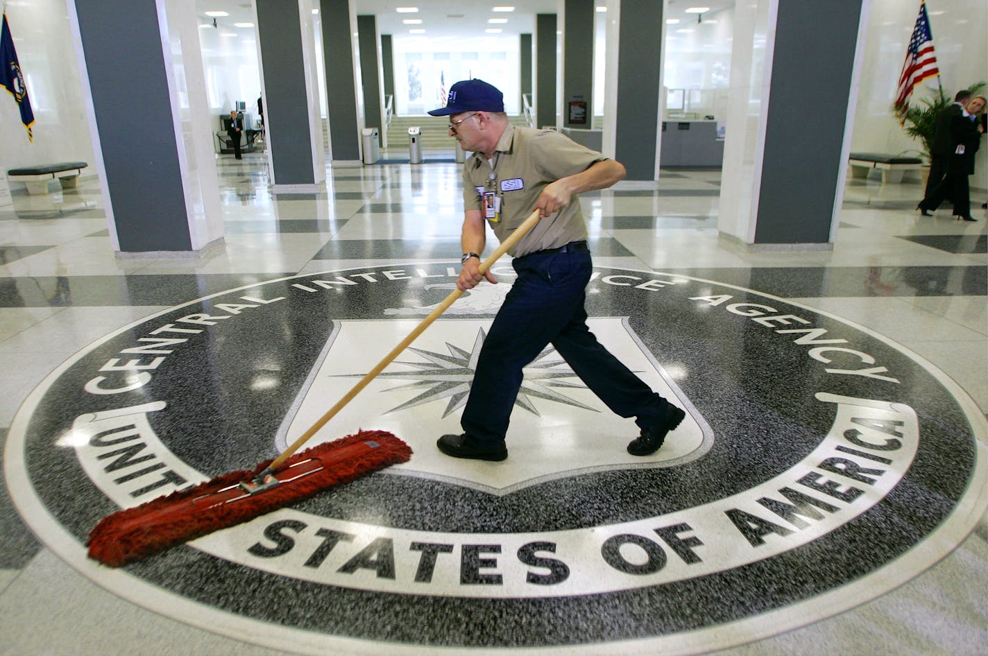 FILE - In this March 3, 2005 file photo, a workman slides a dustmop over the floor at the Central Intelligence Agency headquarters in Langley, Va. President Barack Obama has ordered intelligence officials to conduct a broad review of election-season cyberattacks, including the email hacks that rattled the presidential campaign and raised fresh concerns about Russia's meddling in U.S. elections, the White House said Friday. (AP Photo/J. Scott Applewhite)