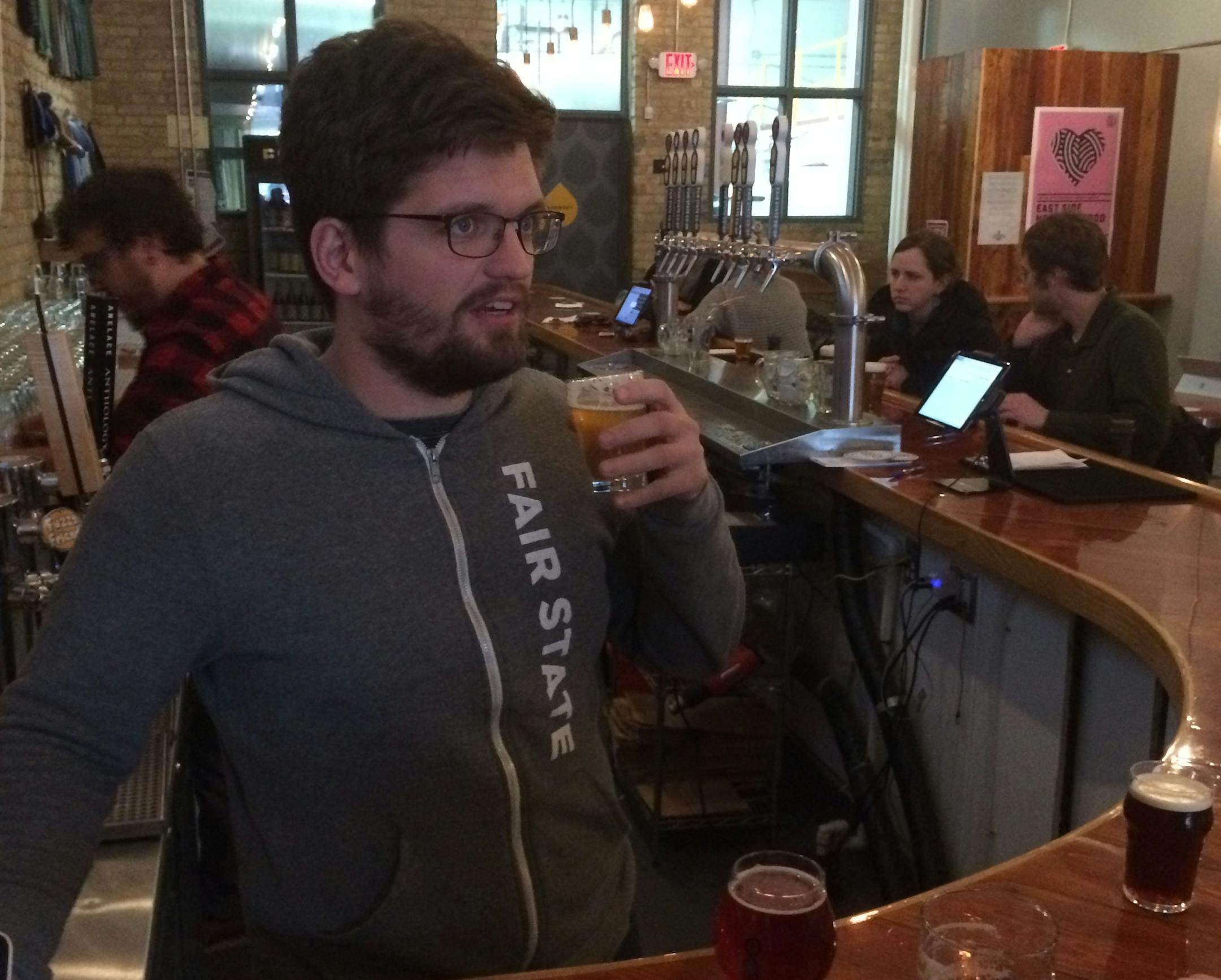 Evan Sallee, a co-founder of Fair State Brewing Cooperative, tends bar at Minnesota's only cooperatively owned microbrewery, in Northeast Minneapolis. Photo: Neal.St.Anthony@startribune.com